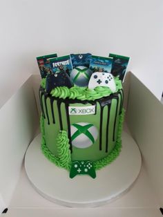 a cake decorated with video games and books