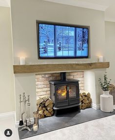 a fireplace with a tv on top of it