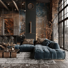 a living room filled with lots of furniture next to large windows and a brick wall