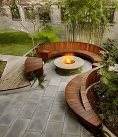 a wooden bench sitting next to a fire pit