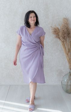 Handmade washed linen mid-calf close-fitting wrap dress with short kimono sleeves, pockets and belt. Made with love for You. *100% local medium weight linen *Suitable for maternity or nursing *Each item is individually cut and sewn by order *The model height is 172 cm *The model is wearing size XL *The dress color - Lilac *Note that colors may look different on your display depending on their settings and technical characteristics. Please let us know if you need different measurements or colors. Lilac Linen Dress, Spring Linen Wrap Dress, Lilac Colour Dress, Wrap Sundress, Lilac Colour, Linen Wrap Dress, Purple Linen, Cotton Wrap Dress, Lilac Blue