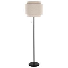 a black floor lamp with a white shade