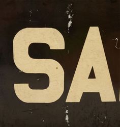 an old black and white sign that says sale