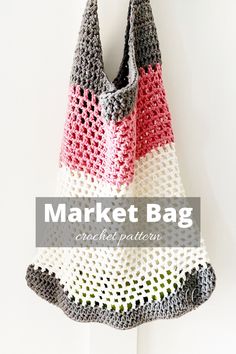 a crocheted market bag hanging from a hook with the words market bag on it