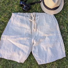 The GALEN Linen Shorts, complete with an adaptable waistband and zippered pockets, are your ultimate summer sidekick. Whether you're hitting the office, grabbing a drink at the bar, or chilling in the park, these shorts got your back. Linen screams sophistication, class, and allure, making these shorts the epitome of summer chic. Now, let's talk about that waistband—it's got an elastic bit in the back and a drawstring so you can customize the fit to perfection. Plus, we've hooked you up with zip Mens Linen Shorts, Mens Linen Pants, Linen Pajamas, Office Bar, Mens Linen, Lightweight Shorts, Summer Chic, Summer Fabrics, Pajama Set Women