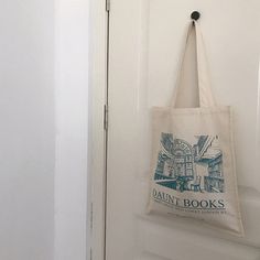 a tote bag hanging on the front door