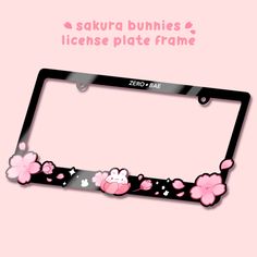 the license plate frame is decorated with pink flowers and skulls on it, along with hello kitty's name