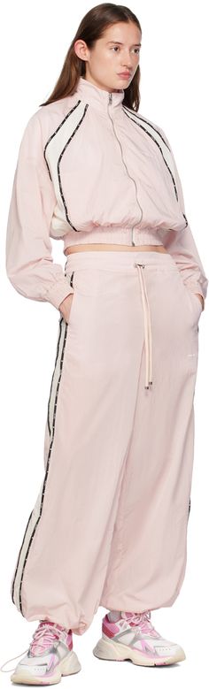 Wide-leg crinkled nylon taffeta track pants. · Cord-lock drawstring at elasticized waistband · Two-pocket styling · Logo printed at front leg · Bungee-style drawstring at cuffs · Logo-patterned piping at outseams · Leather logo patch at back waistband · Logo-engraved silver-tone hardware Supplier color: Rosewater Nylon Lounge Sweatpants With Pockets, Nylon Sweatpants With Pockets For Loungewear, Nylon Pants With Elastic Waistband, Nylon Parachute Pants With Drawstring, Nylon Pants For Spring Loungewear, Spring Nylon Pants For Loungewear, Spring Nylon Loungewear Pants, Spring Nylon Lounge Pants, Nylon Parachute Pants For Loungewear