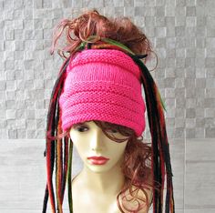 a mannequin head with dreadlocks on it's head and pink top