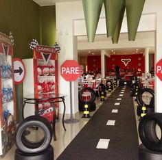 there are many tires lined up on the floor in this room with no parking signs