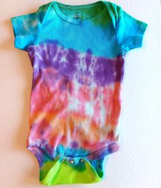 Rainbow Tie Dye Baby Body Suit , Colorful Baby T Shirt With 3 Snap Crotch Blue Yellow Green Purple Pink Indigo Size 12-18 Months  Baby will look and feel cool this Summer in this adorable cotton one piece bodysuit that was hand dyed using colors including aqua blue , indigo , pink, purple ,  yellow , and green. Super cute short sleeved shirt for baby has a three snap closure at the crotch for easier dressing and diaper changes. This one piece snap shut top is infants size 12-18 Months . Bodysuit Tie Dye Tops, Violet Rose, Rainbow Tie Dye, Rainbow Tie, Big Gifts, Baby Colors, Baby T Shirts, One Piece Bodysuit, Baby T Shirt