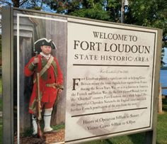 a welcome sign to fort loudoun state historic area, with an image of a man in uniform