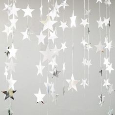 some white stars hanging from the ceiling