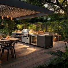 an outdoor kitchen and dining area is lit up at night with lights on the ceiling