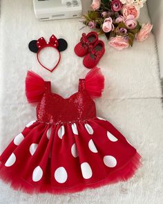 a red minnie mouse dress and matching headband