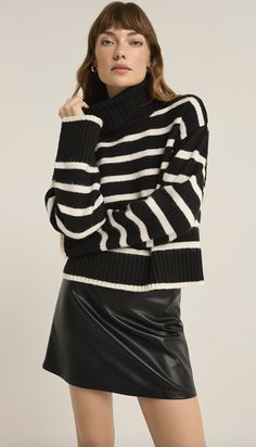 Meet your new favorite turtleneck sweater, crafted from our midweight plush and soft Yummy Yarns for ultimate coziness. Featuring a classic stripe design, it's perfect for adding a touch of warmth and style to any outfit. Relaxed fit Yummy Yarns: 100% Polyester Turtleneck Long sleeve Midweight Plush sweater knit Hand Wash Cold Separately, Reshape and Lay Flat to Dry STYLE No: ZW243828 Cozy Turtleneck With Ribbed Collar For Layering, Knit Sweater With Horizontal Stripes For Layering, Cozy Striped Sweater For Layering, Fall Striped Soft Knit Sweater, Striped Sweater For Layering In Fall, Striped Soft Knit Sweater For Fall, Chic Sweater With Contrast Stripes For Winter, Casual Striped Turtleneck For Fall, Soft Knit Striped Sweater For Fall