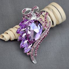 "This listing is for ONE piece of high quality sparkling rhinestone crystal component only. Craft ideas: Add pin, clip, comb, or chain on it to make your own Hair Comb, Shoe Clip, Brooch Pin, Necklace Jewelry or Cake Decoration. Perfect for your Craft DIY Supplies! Measurements(Approx): 2.75\" x 1.75\" ( 68mm x 43mm) Materials: silver metal Australian rhinestones Qty: 1 pc The product is for the above mentioned rhinestone component only, not including all other images/products/designs, which are Cake Invitation, Bouquet Cake, Purple Pixie, Rhinestone Cowgirl, Pin Necklace, Wedding Brooch Bouquets, Bride Gown, Vintage Rhinestone Brooch, Brooch Bouquet