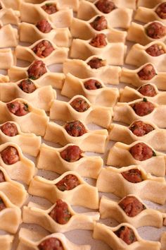 some food that is laying out on a pan together and ready to be cooked in the oven