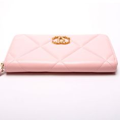 This Chanel 19 Quilted Goatskin Long Zip Around Wallet is . The exterior is in the classic Chanel Goatskin leather. Condition: Very Good Serial Number: L3HT5X01 Color: Pink Exterior: The exterior leather is free of any rips or cracks. The zipper fabric has minor discoloration. Hardware: The zip closure operates properly and runs smoothly. Interior: The interior is clean and free of rips or tears. The interior features one zip closure pocket, eight card slots, and two bill slots. Dimensions: L: 7 Classic Pink Leather Wallet, Luxury Soft Leather Wallets For Business, Luxury Soft Leather Business Wallets, Luxury Pink Leather Wallet, Luxury Soft Leather Wallet For Formal Occasions, Classic Chanel, Chanel 19, Celine Bags, Hermes Bags