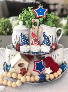 two tiered trays with tea cups and saucers decorated like american flags, stars, and houses