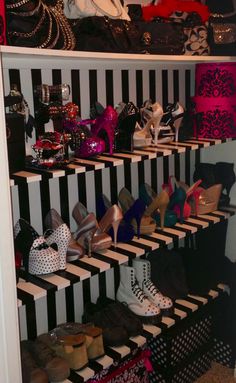 a closet filled with lots of different types of shoes