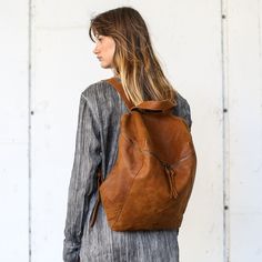 This stunning backpack is made of genuine soft nappa leather in a Honey Brown color. With enough room for all your daily essentials, It is perfect for everyday use, as well as for laptops of most sizes,  IPAD, A4 files, books and travel. It offers a spacious, lined interior with two large compartments, a zipper pocket, and adjustable straps. The antique gold hardware adds a touch of elegance and modernity to the overall look. Features: *  1 Interior large zipped pocket * Outside zipper pocket in Handmade Laptop Bag, Handmade Leather Backpack, Travel Laptop Backpack, Backpack Laptop, Italian Leather Bags, Laptop Bag For Women, Women Leather Backpack, Laptop Rucksack, Backpack Women