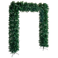 a green christmas tree is hanging on a white wall and it's branches are arranged in the shape of an arch