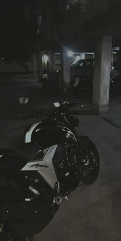 the motorcycle is parked in the parking garage