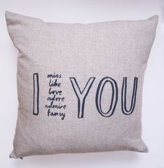 a pillow with the words i miss you on it