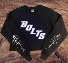 ** please let me know if you need this shirt by a certain date** I'm local to Tampa and will do a porch pick up if needed sooner. A rush charge will occur. !!BOLTS!! Lighting shirt perfect for watching the game at home or on the ice! Shirt can come either short or long sleeve & either full length or cropped. Sizing is unisex Gildan brand. I recommend hand washing or gentle cycle and air dry! 💙 Tampa Bay Lightning Shirt, Tampa Bay Lighting, Lightning Shirt, Ice Shirt, Plant City, Tampa Bay Lightning, The Ice, Tampa Bay, Hand Washing