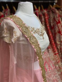 Dusky peach heavy kundan border lehenga with contrasting pearl white floral zardozi embroidery blouse and net border dupatta. Fabric: Raw Silk This outfit can be customized in multiple colors and specific to client measurements. 90 days of production time is required and are for bulk orders only! Orders are processed in store only! Final fittings/alterations not included. Minimum Order Quantity- 4 pieces Reception Peach Dupatta With Zari Work, Peach Dupatta With Zari Work For Reception, Traditional Peach Dupatta For Reception, Designer Peach Dupatta With Pallu, Semi-stitched Peach Choli With Sheer Dupatta, Peach Semi-stitched Choli With Sheer Dupatta, Designer Peach Lehenga With Zari Work, Semi-stitched Peach Lehenga With Sheer Dupatta, Bollywood Style Peach Choli With Zari Work