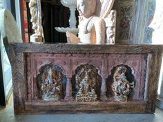 an old wooden bench with carvings on it