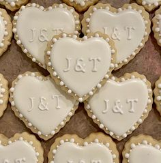 decorated cookies arranged in the shape of heart with names and date displayed on each cookie