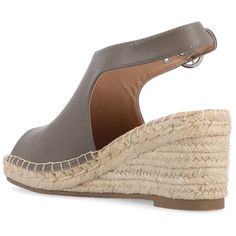 Show off summer-ready style with espadrille wedges. Smooth faux leather uppers with a buckled ankle strap style complements intricate textured espadrille wedge sandals. Top-stitching borders the sole of each shoe to complete the look. At Journee Collection our sandal styles are going to be perfect for any occasion. Whether that be a formal business or casual dress these sandals will be a perfect match. Leather Espadrilles With Wedge Heel For Spring, Leather Wedge Heel Espadrilles With Buckle Closure, Leather Espadrilles With Buckle Closure And Wedge Heel, Espadrille Wedge Sandals With Buckle Closure, Spring Espadrille Wedge Sandals With Buckle, Spring Buckle Closure Closed Toe Espadrilles, Casual Espadrille Wedge Sandals With Buckle Closure, Casual Espadrille Wedge Sandals With Buckle, Heeled Espadrilles