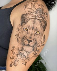 a woman with a lion tattoo on her arm