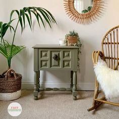 a chair and table in a room with potted plants on the floor next to it