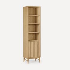 a tall wooden bookcase with three shelves on one side and two drawers on the other