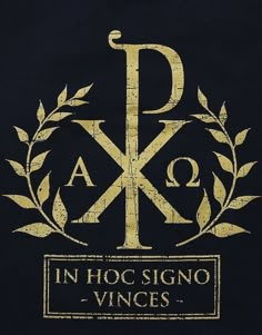 a black shirt with gold letters and an image of the letter k in hoc signo - vines