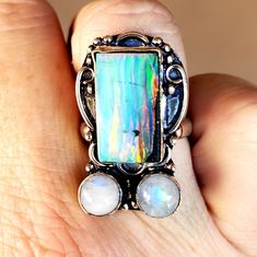 Brand New Handmade Amazing Unique Rainbow Moonstone And Opal Silver Statement Ring. Size 7.25 925 Stamped New To Poshmark? Use Referral Code Kimberlyn222 To Receive $10. Adjustable Multi-stone Moonstone Ring Gift, Healing Moonstone Ring With Natural Stones, Adjustable Silver Moonstone Multi-stone Ring, Handmade Celestial Silver Opal Ring, Adjustable Stamped 925 Moonstone Ring, Handmade Moonstone Ring For Healing, Artisan Moonstone Jewelry, Unique Moonstone Ring, Iridescent Bohemian Rings