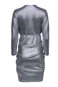 Get ready to party in this IRO silver ruched dress. With its shimmery silver fabric and stylish v-neckline, you'll stand out from the crowd. The ruched design adds a fun and flirty touch, perfect for pairing with your favorite strappy heels. The only thing missing is a dance floor! Size 4 (FR 36) Shell 95% Polyester, 5% Spandex Lining 100% Polyester Pull on V-neckline Long sleeve Ruched detail Bust 36” Waist 28” Shoulder to hem 40” Sleeve length 28” Silver Ruched Dresses For Party Season, Metallic Ruched Dresses For Cocktail, Silver Shimmer V-neck Mini Dress, Silver Ruched Dress For Night Out, Holiday Ruched V-neck Mini Dress, Silver Ruched Dress For Formal Occasions, Metallic Ruched Dress For Date Night, Silver Ruched Formal Dresses, Silver V-neck Mini Dress For Holiday Party