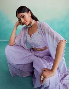 Introducing the serenity jacket set in digital lavender - a stunning ensemble crafted with love from chanderi fabric. Featuring a hand-embroidered crop top and jacket adorned with exquisite mirror work, it's perfect for making a stylish statement on any occasion. Paired with a micropleated sharara, this set offers elegance and comfort in one stunning Digital Lavender, Embroidered Crop Tops, Sharara Set, Mirror Work, Hand Embroidered, With Love, Lavender, Crop Top, Crop Tops