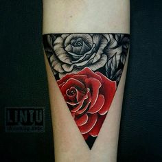 a red rose tattoo on the leg