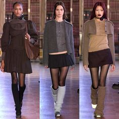 three models walking down the runway in tights and knee - high boots, all wearing sweaters