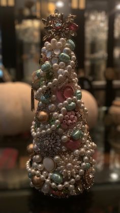 a christmas tree made out of pearls and other beads