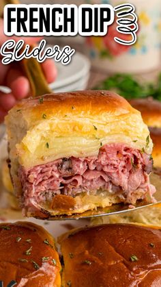 a close up of a sandwich on a plate with the words french dip sliders