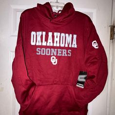 University Of Oklahoma Sooners Marquee Hoodie Smoke Free Closet Size: Xl. Color: Red, White. 100% Polyester. Approximate Measurements While Laying Flat. Armpit To Armpit: 24” Shoulder To Bottom Hem(Length): 28” Sleeves: 24” Oklahoma Sooners And The Ou Logo Are On The Front. An Oklahoma Ou Logo Is Also On The Left Sleeve. (Photos 1,8,9) The Back Is Blank. Hoodie Is Still In The Original Plastic Packaging. If You “Like” The Item, Try Making An Offer. Please Let Me Know If You Have Any Questions. Thanks For Checking Out My Closet! Norman Oklahoma Kansas City Chiefs Texas Rangers Dallas Stars Fc Dallas Dall Collegiate Red Hoodie Top, Red Team Spirit Hoodie, University Red Collegiate Hoodie, Red Hoodie With Team Name For Winter, University Red Collegiate Long Sleeve Hoodie, Collegiate Red Hooded Top, University Red Long Sleeve Collegiate Hoodie, Red Hooded Top For Fan Gear, Red Team Spirit Hoodie For Fall