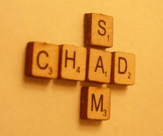 scrabble tiles spelling the word chad and mj's on a wall