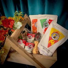 an assortment of food items in a wooden box