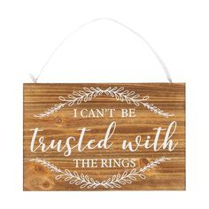 a wooden sign with the words i can't be trusted with the rings