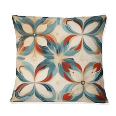 a decorative pillow with blue, red and orange flowers on it's back side